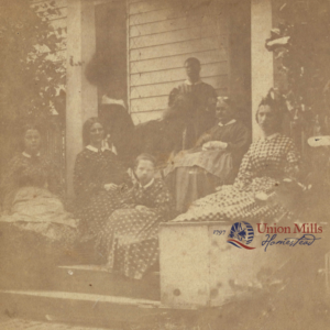 Ca. 1860 photograph of William Shriver's family on the front porch with Ruth or Priss standing in the background.